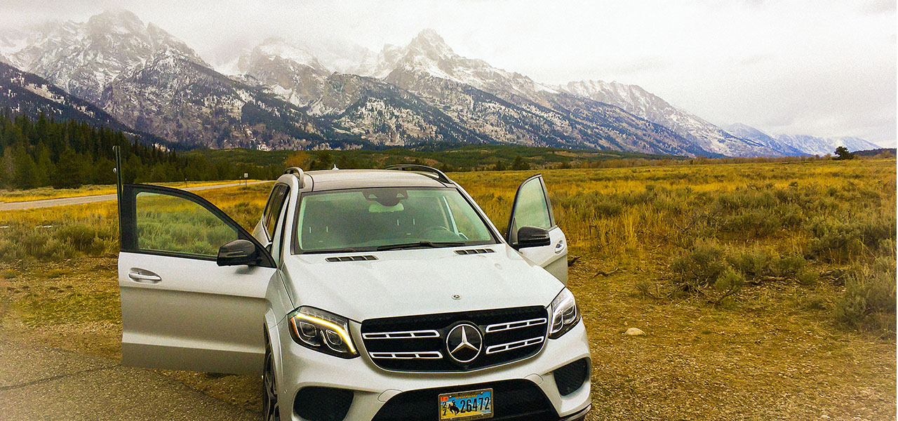 The image of mountain covered with show and a road