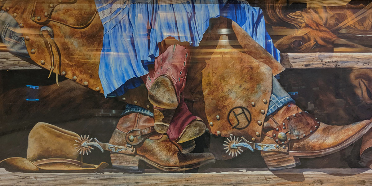 The image taken at the Jackson Hole airport about cowboy tradition